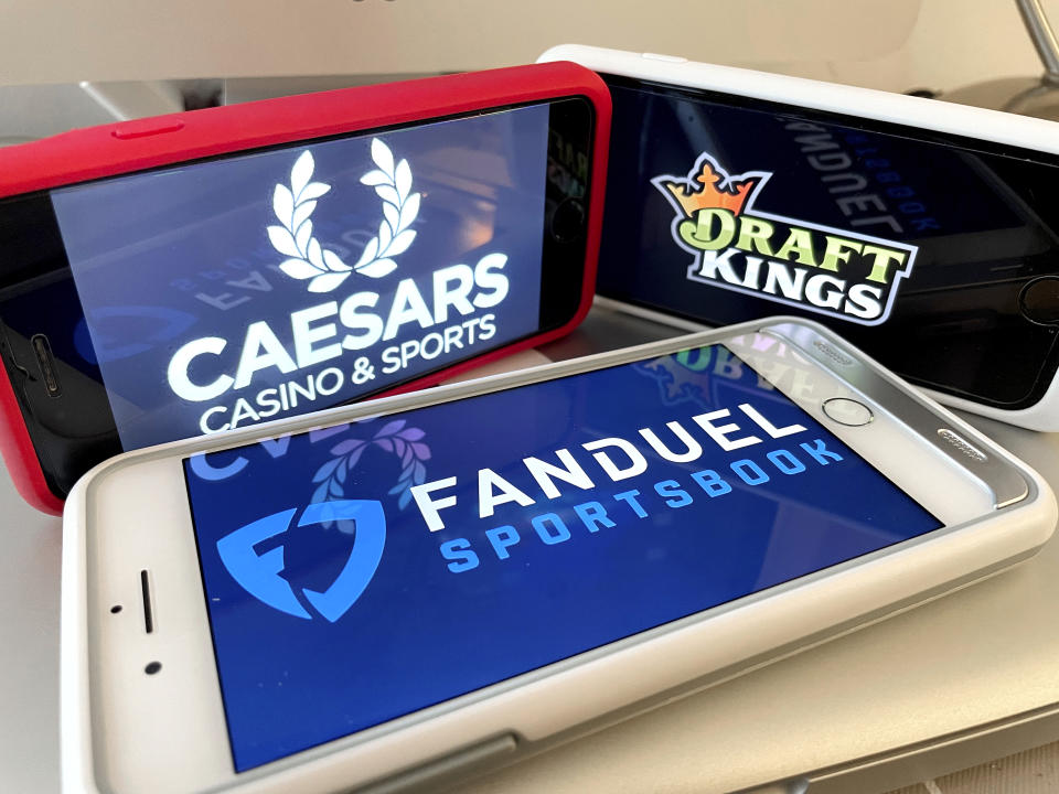 Photo by: STRF/STAR MAX/IPx 2022 1/7/22 New York's online sports event will begin on Saturday, January 8th. Fanduel, Caesars, Draftkings and Rush Street Interactive met regulatory requirements earlier this week. Here, Caesar, Draft Kings and Fanduel logos taken on multiple iphone devices.